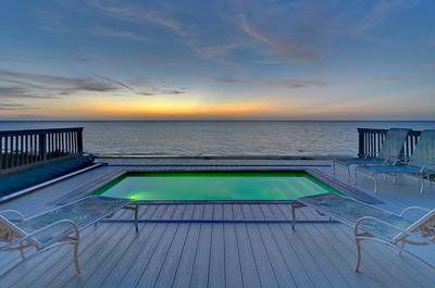 The pool at sunset at The Family Beach House on San Salvador 